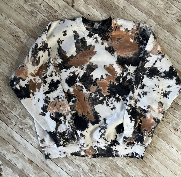 Image of a sweatshirt bleached to look like an acid wash or cowhide look